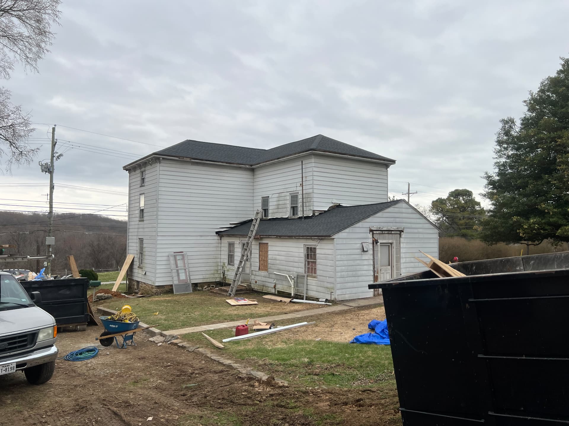 New roof shingles on the farmhouse and rear addition
