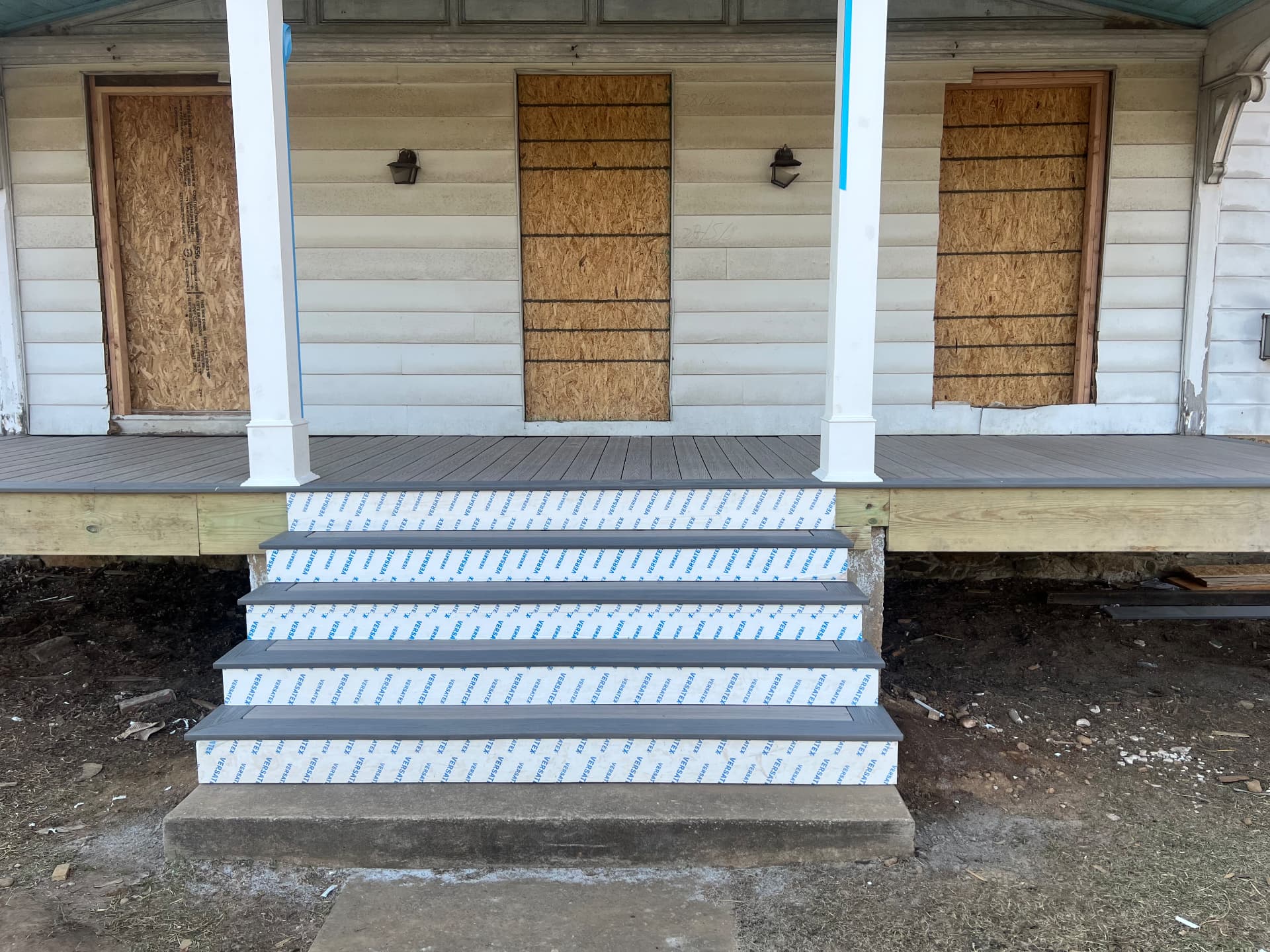 New porch steps and columns at the front of the farmhouse