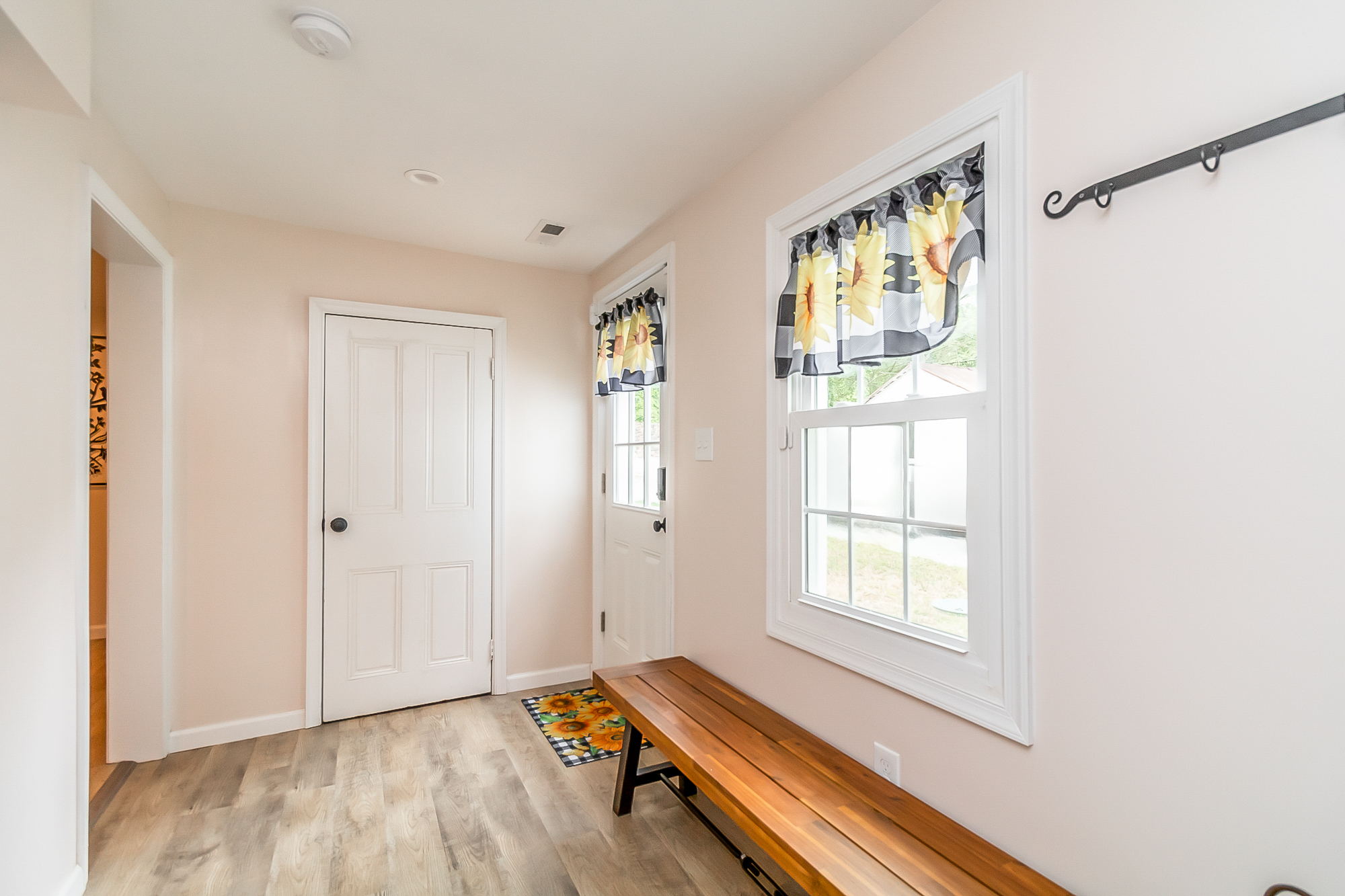 Bright rear entry hall with new windows and trim