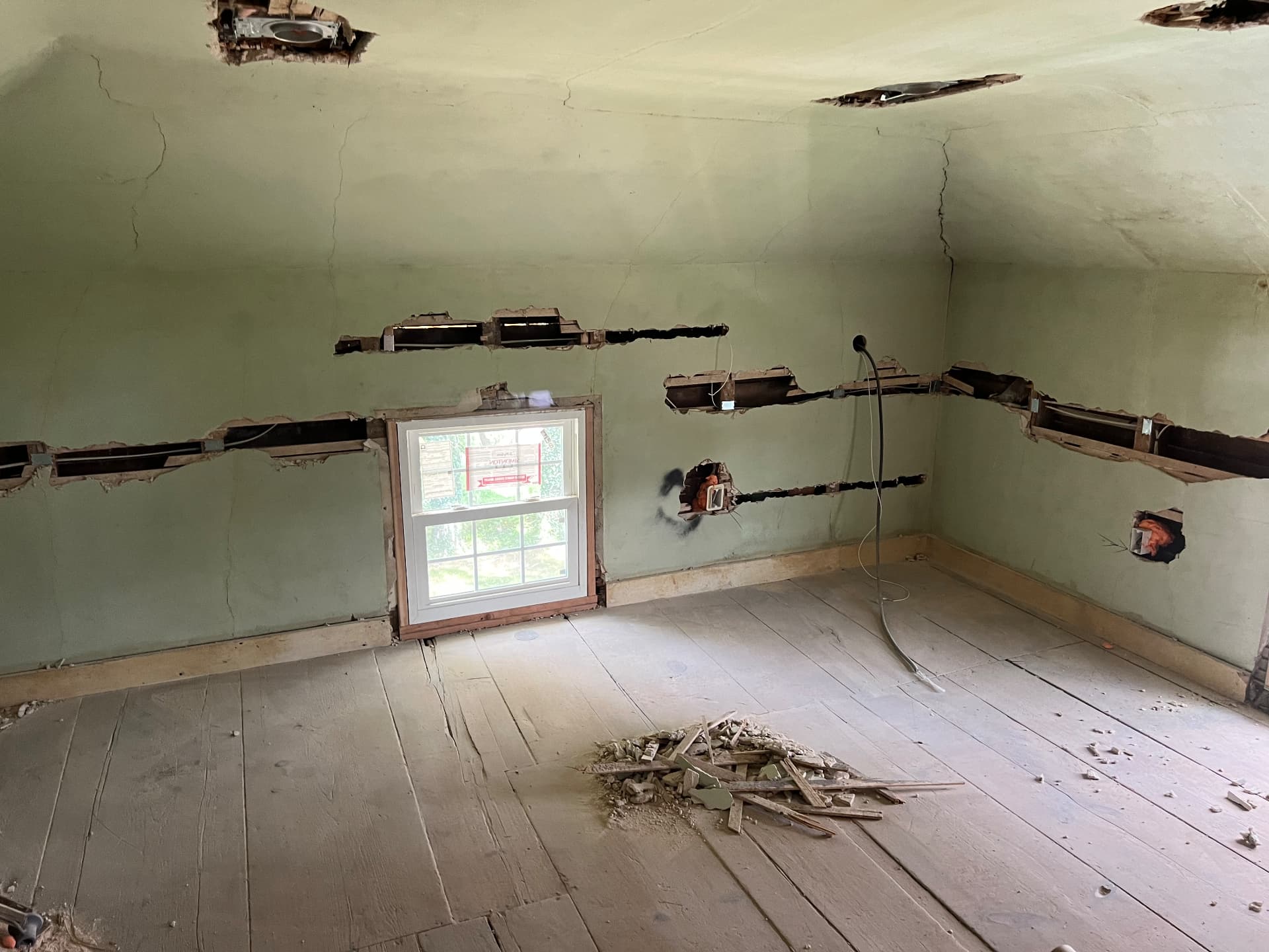 Bedroom walls channeled for new wiring around a replacement window