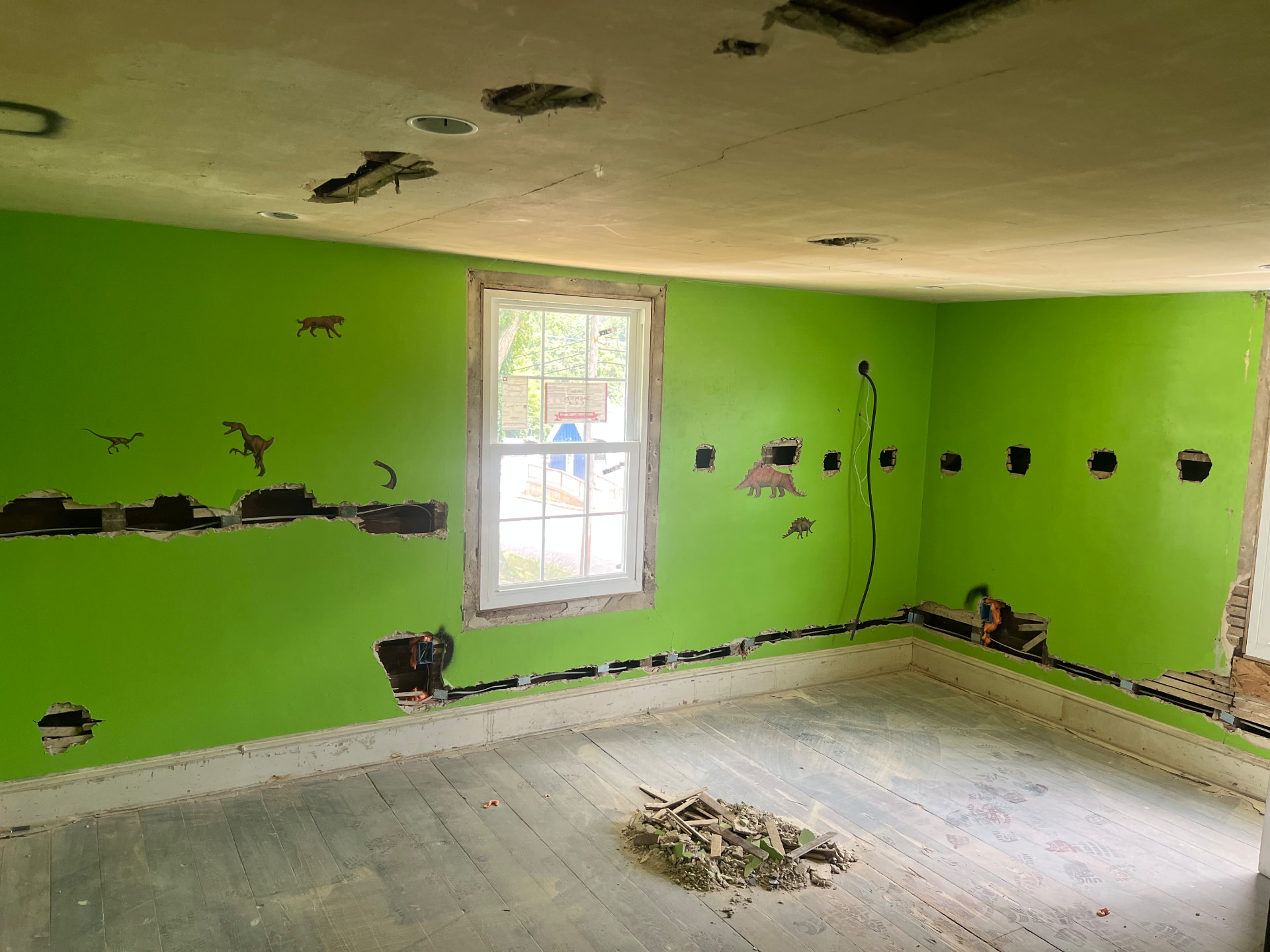 Old bedroom with walls channeled for new wiring before replastering