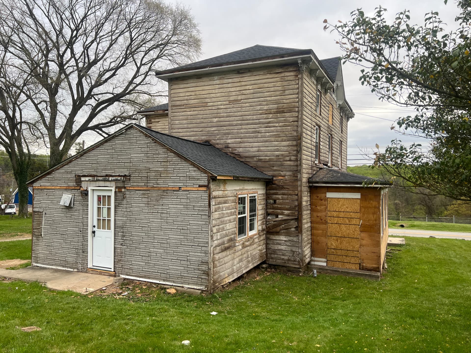 Back corner of the house and addition stripped for new siding