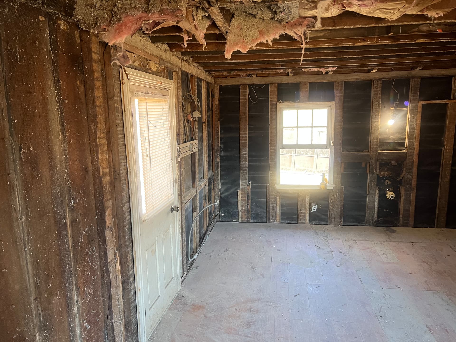 Back room taken back to original plank walls and floor joists
