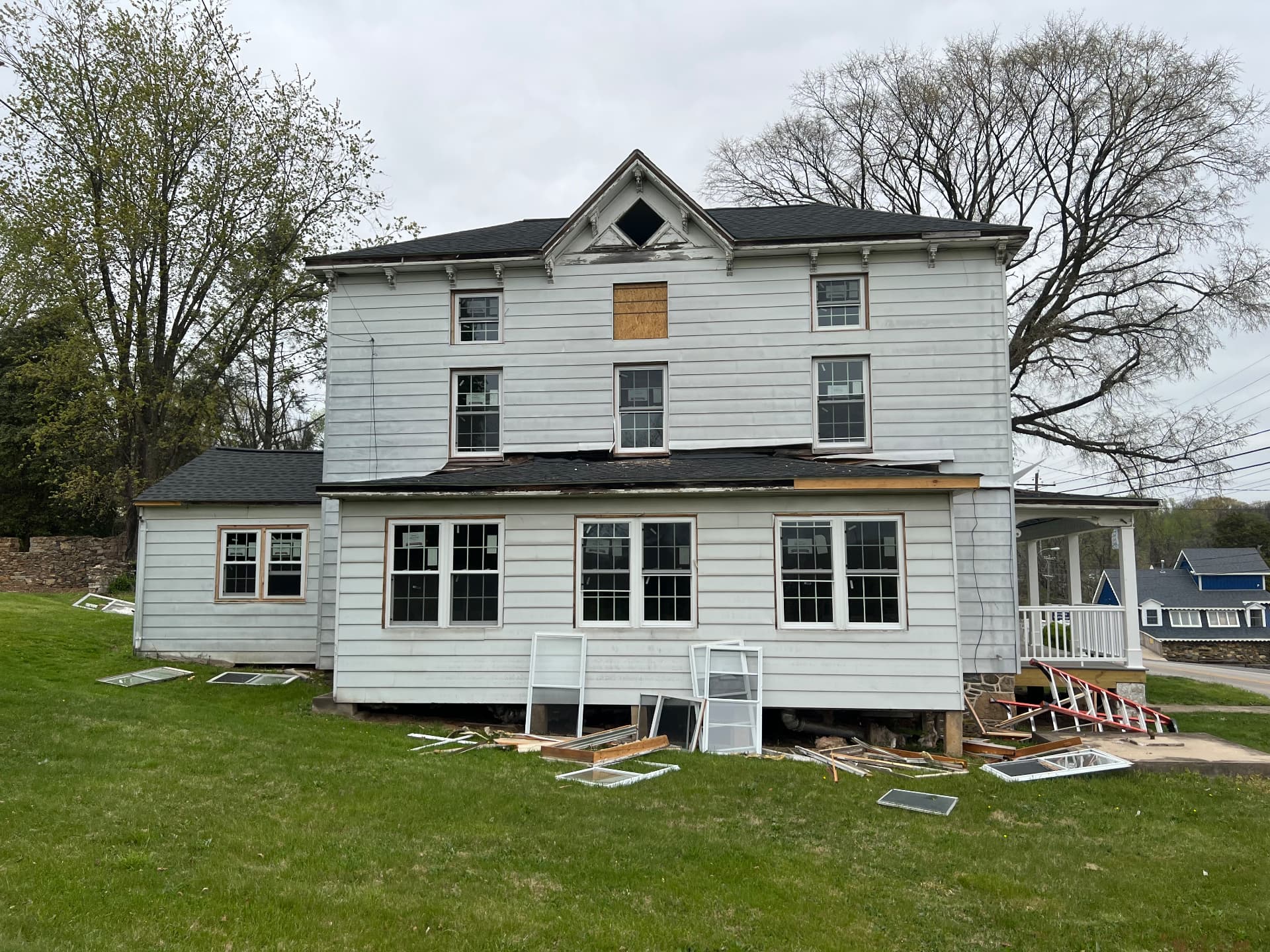 Old windows removed as the exterior is prepped for new siding