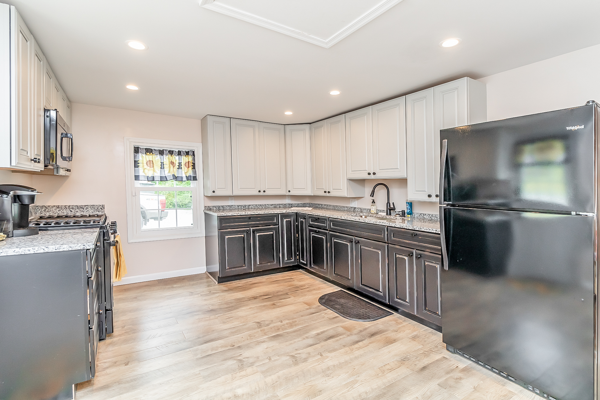 Finished kitchen with granite counters, new cabinets and appliances